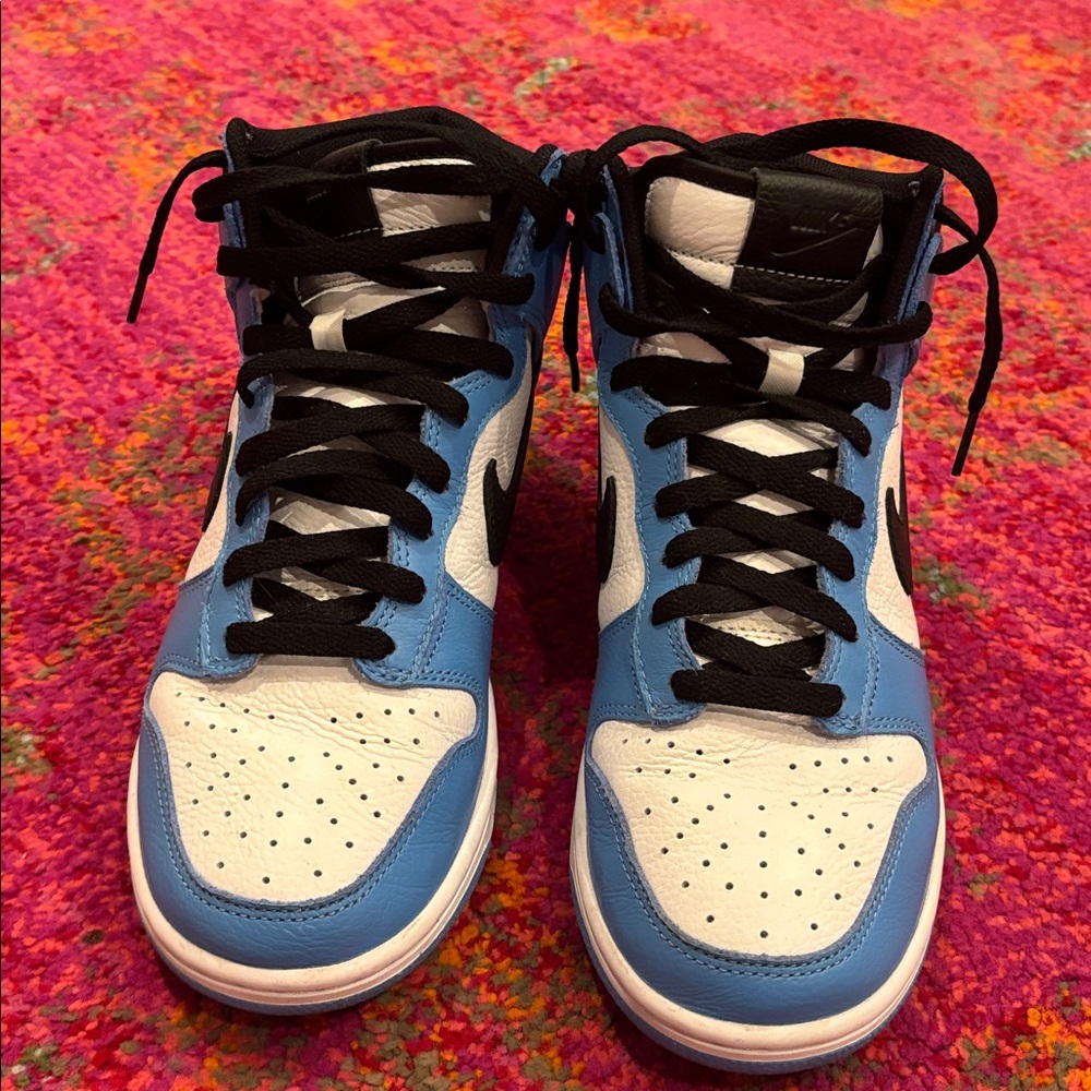 Custom lightly worn Nike blue, white and
Black High Tops